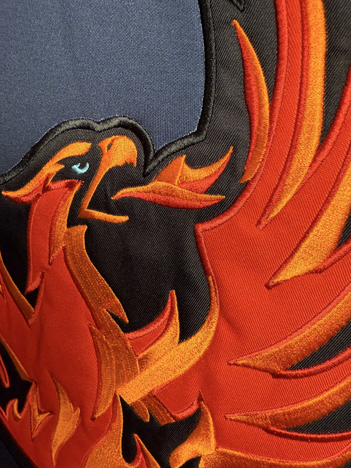 Close-up of the embroidered crest on a hockey lace hoodie