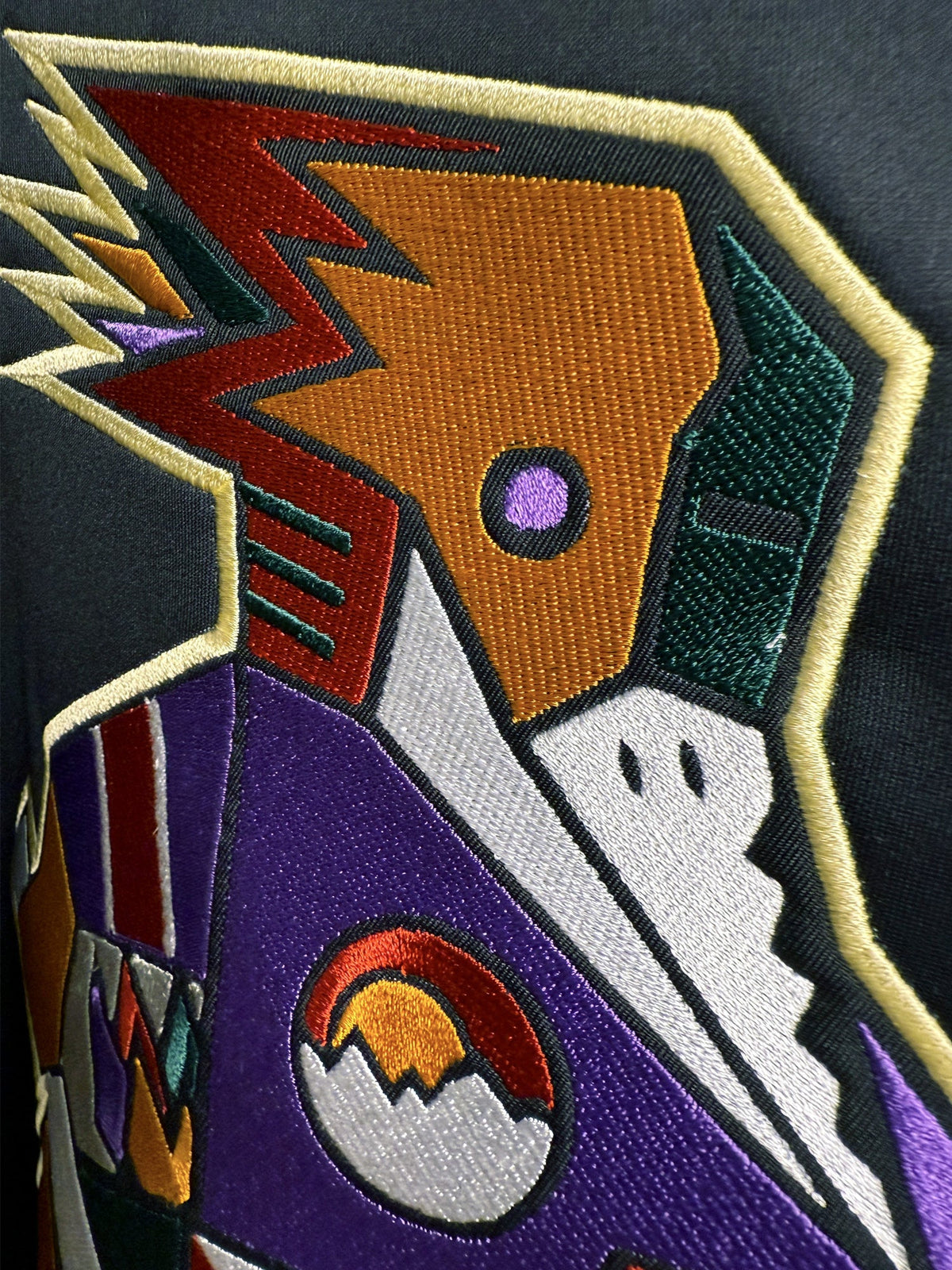 Close-up of embroidered Tucson Roadrunners crest stitching