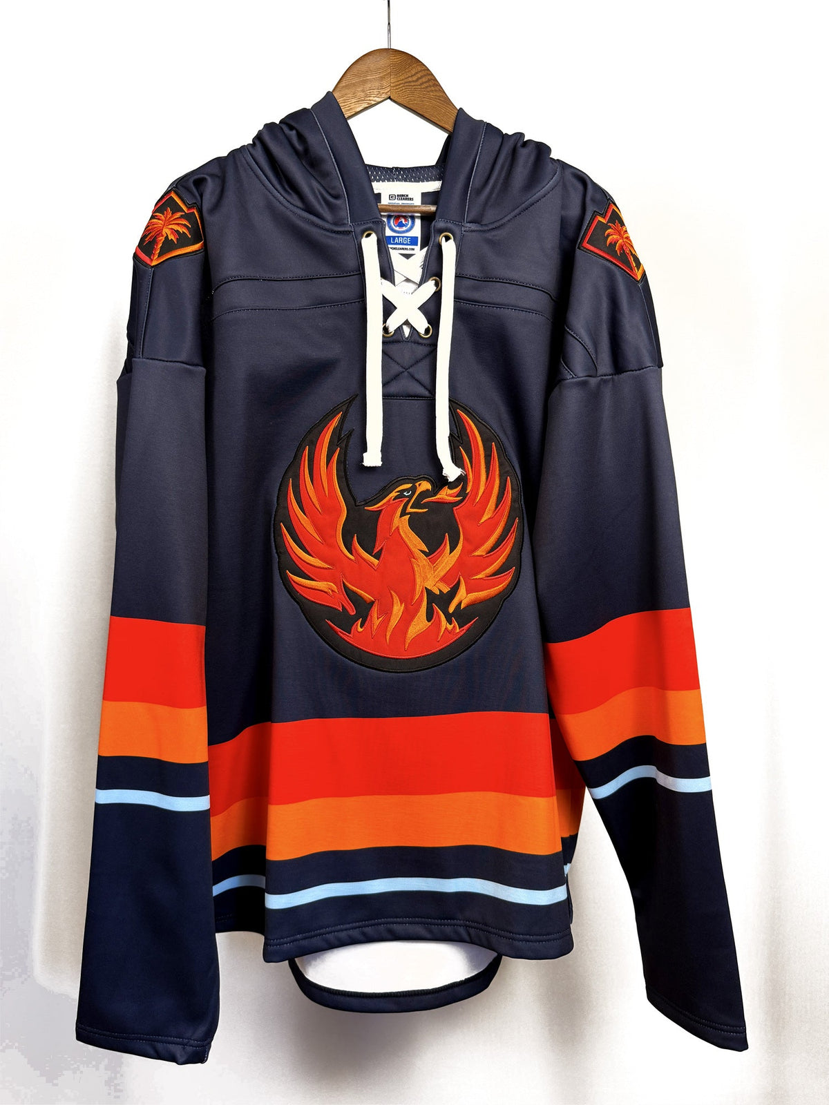 Coachella Valley Firebirds hockey lace hoodie on a hanger