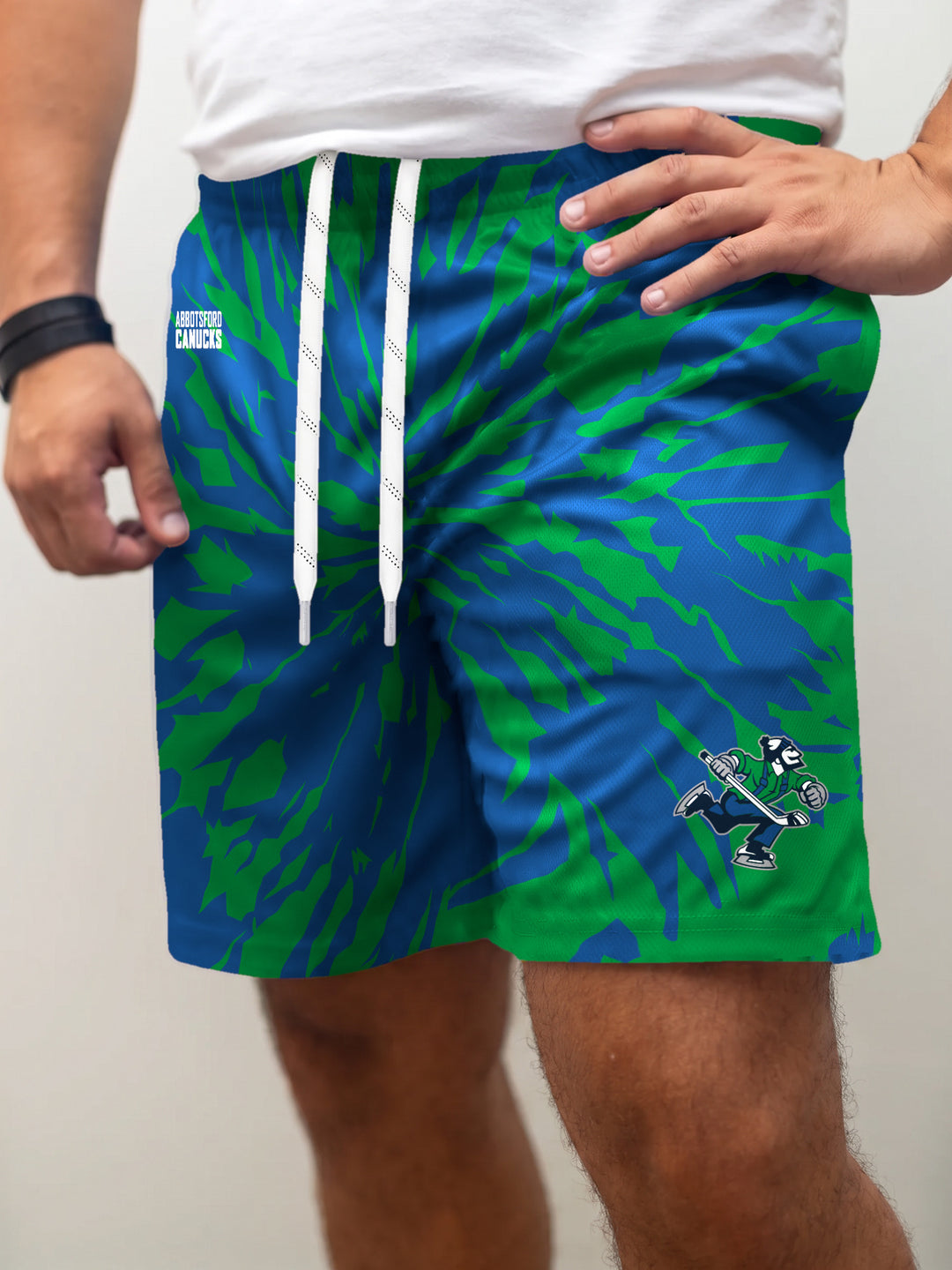 Model wearing the Bench Clearers Abbotsford Canucks Tie-Dye Hockey Shorts - front view