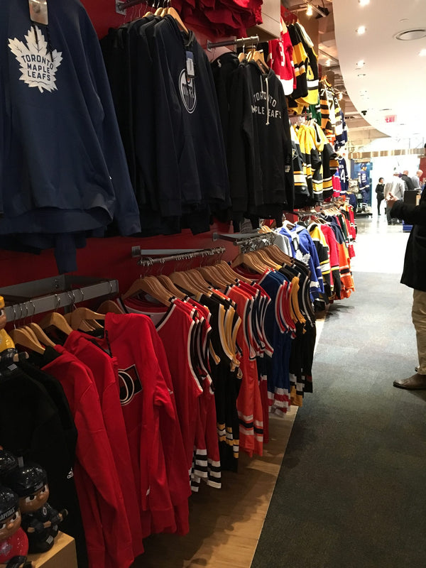 Bench Clearers hockey tanks in an aisle of the Hockey Hall of Fame store in Toronto