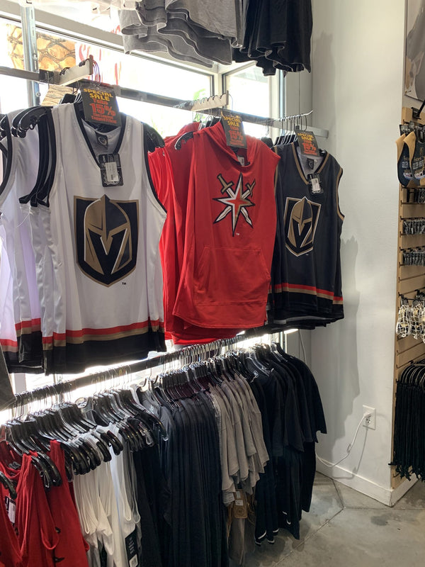 White, red and black Bench Clearers Vegas Golden Knights hockey tanks on the wall at The Arsenal