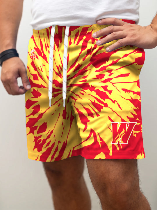 Model wearing the Bench Clearers Calgary Wranglers Tie-Dye Hockey Shorts - front view