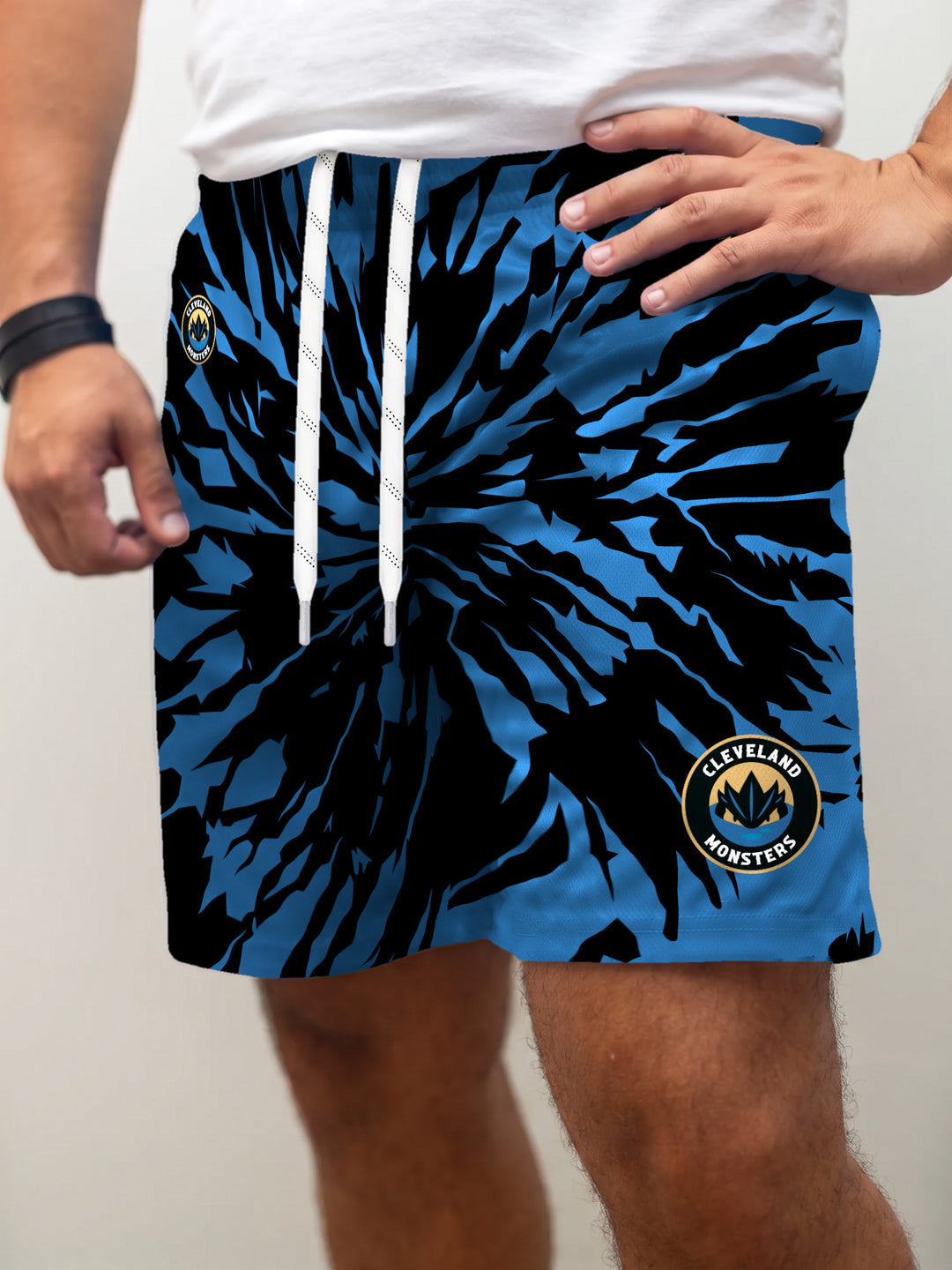Model wearing the Bench Clearers Cleveland Monsters Tie-Dye Hockey Shorts - front view