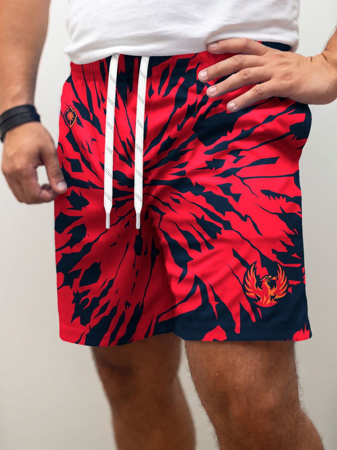 Model wearing the Bench Clearers Coachella Valley Firebirds Tie-Dye Hockey Shorts - front view