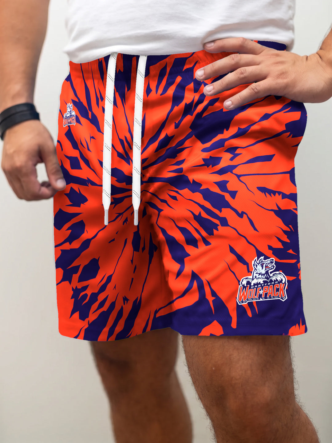 Model wearing the Bench Clearers Hartford Wolf Pack Tie-Dye Hockey Shorts - front view