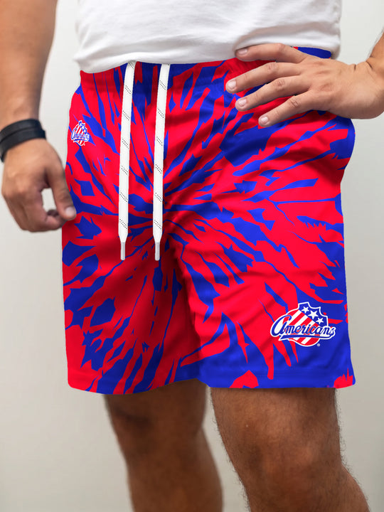 Model wearing the Bench Clearers Rochester Americans Tie-Dye Hockey Shorts - front view