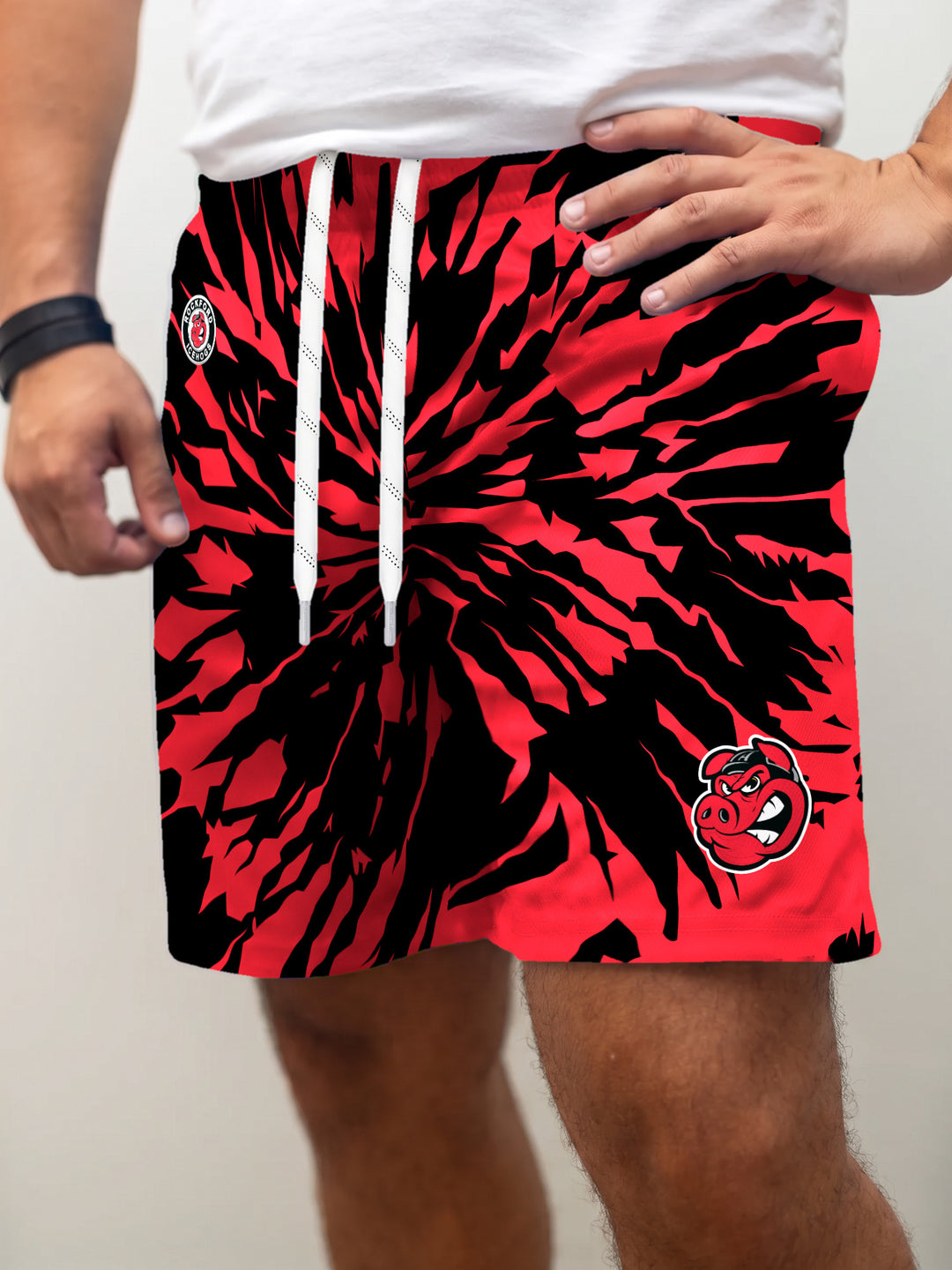 Model wearing the Bench Clearers Rockford IceHogs Tie-Dye Hockey Shorts - front view
