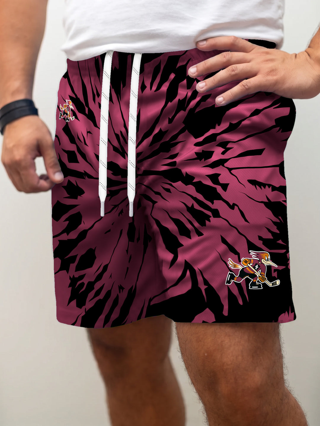 Model wearing the Bench Clearers Tucson Roadrunners Maroon Tie-Dye Hockey Shorts - front view