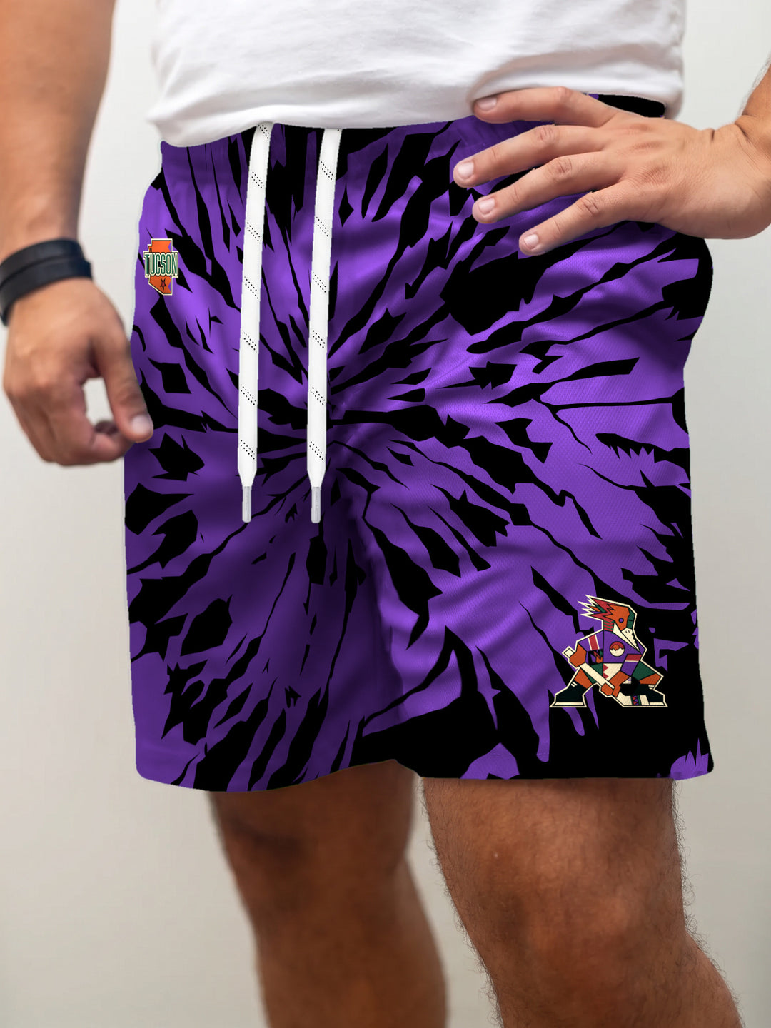 Model wearing the Bench Clearers Tucson Roadrunners Purple Tie-Dye Hockey Shorts - front view