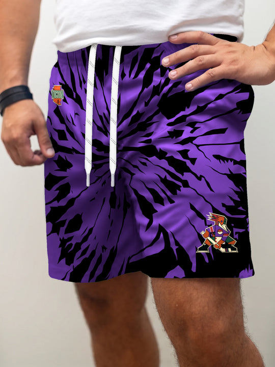 Model wearing the Bench Clearers Tucson Roadrunners Purple Tie-Dye Hockey Shorts - front view