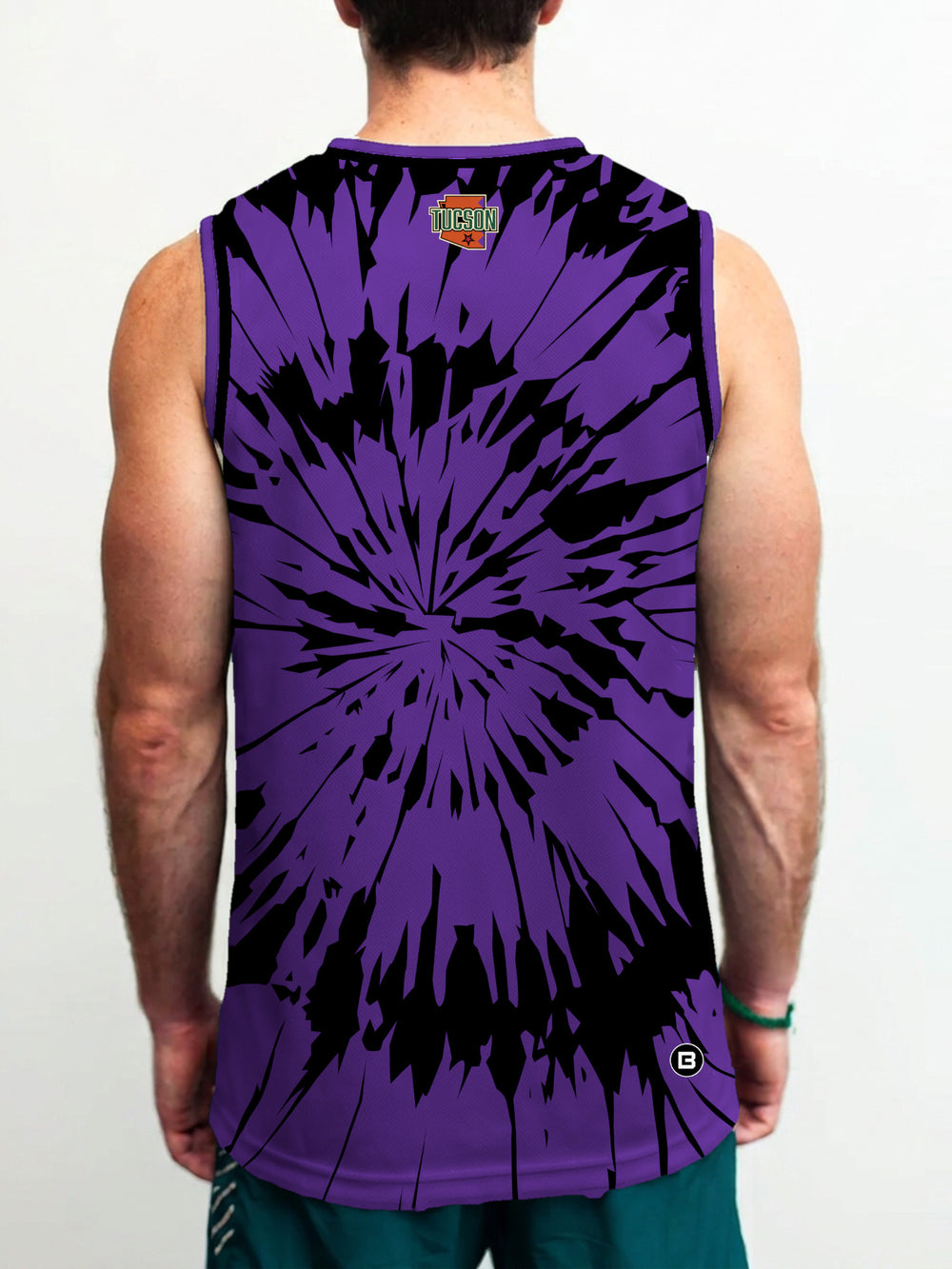 Model wearing the Bench Clearers Tucson Roadrunners Purple Tie-Dye Hockey Tank - back view