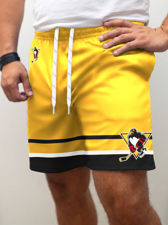 Model wearing the Bench Clearers Wilkes-Barre/Scranton Penguins Alternate Hockey Shorts - front view