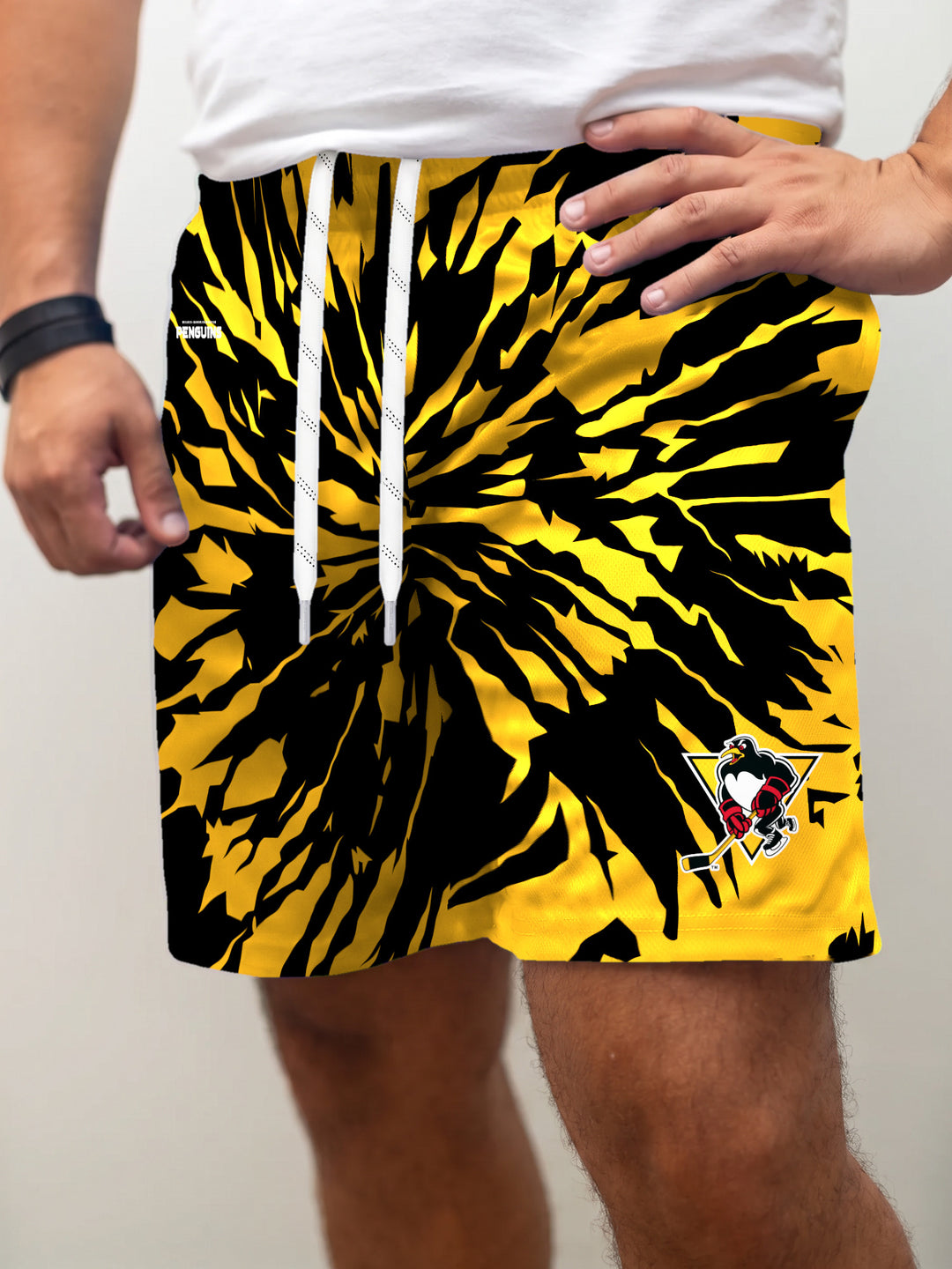 Model wearing the Bench Clearers Wilkes-Barre/Scranton Penguins Tie-Dye Hockey Shorts - front view